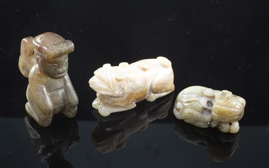 A Chinese grey jade figure of a recumbent lion-dog and two other jade figures, 19th century and later, 7.3cm